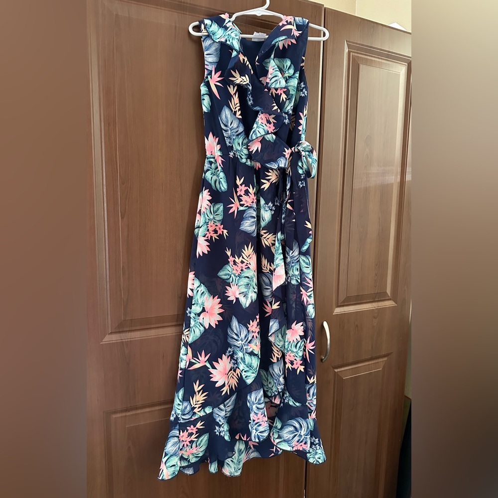 Youth Girls dress size 7. Navy blue with bright flowers, ruffles and side tie.